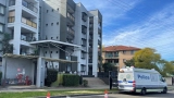 Blacktown apartment block under police guard after six residents test positive to COVID-19