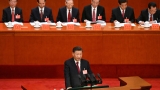 China’s Xi downplays need for rapid growth, praises Covid achievements