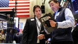 Dow drops more than 200 points to start the week as worries over China Covid protests grow