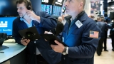 Dow rises more than 200 points after another report hints that inflation could be slowing