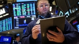 Stock futures slip as investors await October retail sales data