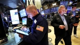 Stocks waver as yields rise and investors look ahead to 2023