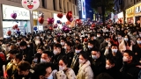 Chinese state media seek to reassure public over Covid-19