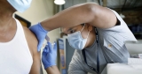 Is it safe to get COVID booster and flu shot at the same time? What experts say