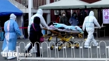 China Covid: Hospitals under strain in wave of infections – BBC