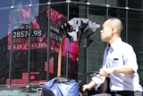 World shares advance after Wall Street’s end of week rally