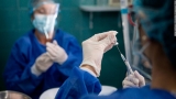 What precautions people who are immunocompromised should take before returning to in person work