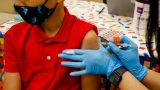 More than 100,000 people hospitalized with Covid-19 for first time in nearly four months