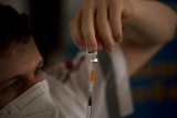 Vaccine booster shots highlight pandemic inequality amid World Health Organization’s call for a moratorium