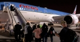 Collapsing passengers, CDC missteps and “public health malpractice”: The story of the COVID flight from hell
