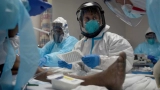 US officials considering revising mask guidelines and recommending booster shots as COVID-19 cases soar