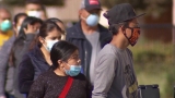 As COVID-19 cases surge, CDC says it will update its mask guidance