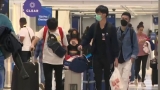 Watch CBS Evening News: CDC lifts COVID test requirement for travelers