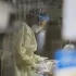 The Latest: Qantas to require vaccines for airline workers