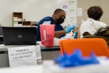 Amid tripledemic, covid boosters cut hospitalization risk by 50 percent
