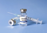 What is the link between influenza vaccination and the severity of COVID-19 infection?