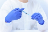 What is the association of SARS-CoV-2 vaccination with the risk of PASC in patients with SARDs?