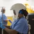 CDC leader adds people with risky jobs to COVID booster list