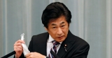 Japan health minister says Okinawa vaccine contaminants likely from needle stick