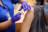 Top FDA official says boosters might be warranted for everyone 18 and older