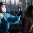 The Latest: States, businesses reconsider mask wearing in US
