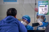 China’s vast Xinjiang hit with COVID-19 travel restrictions