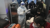 U.S. will require travelers from China to show negative COVID test before flight : NPR