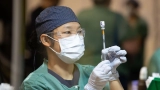 Health authorities ramp up COVID-19 booster and flu vaccine push as winter case numbers rise