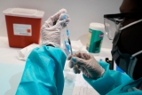 The Latest: Japan reports daily record for new virus cases