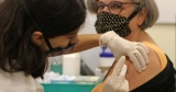 COVID-19 vaccine booster shot side effects similar to first two doses, says CDC