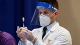 US regulators weigh whether people can mix COVID booster shots