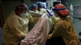 US hospitals strained with influx of patients amid latest COVID-19 surge, staffing shortages