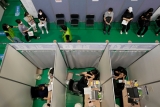 The Latest: Britain skips quarantine of vaccinated visitors