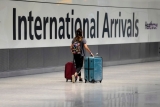 The Latest: Australian state reports daily virus case record
