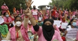 These female health-care workers won a huge WHO honor. They’d like a raise, too