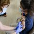 WHO Urges Vaccinated People to Continue Wearing Masks