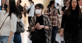 Authorities are urging indoor masking in major cities as the ‘tripledemic’ rages