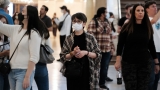 Local authorities in major cities urge indoor masking : NPR