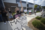Livid parents take their kids out of class in response to a school board member’s Covid misinformation