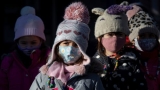 Canada’s top doctor encourages wearing masks as hospitals struggle with virus surges