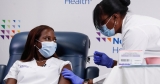 The First Person in U.S. to Get COVID-19 Vaccine Reflects