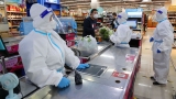 COVID news live: China is sending officials in protective suits into people’s homes with disinfectant spray | UK News